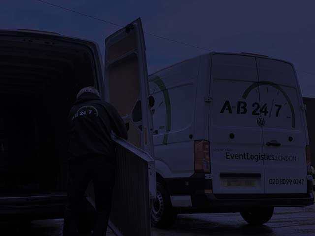 Night photograph or AB247 vans being loaded up