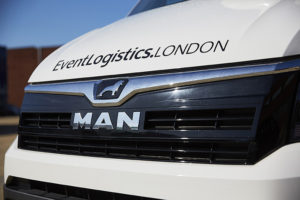 Photo of close up of MAN logo on event van grille