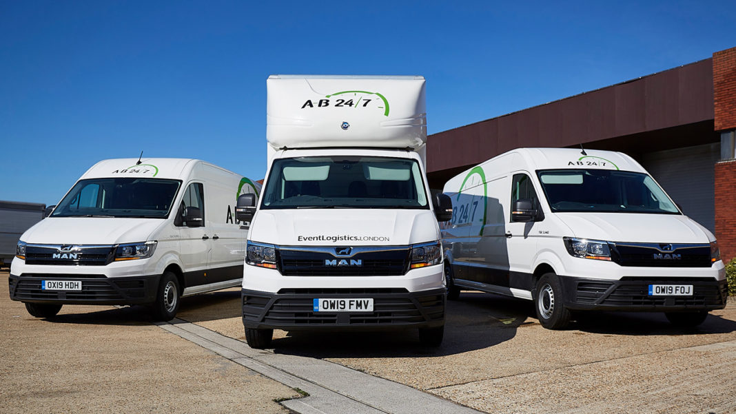 Photo of three event vans in carpark