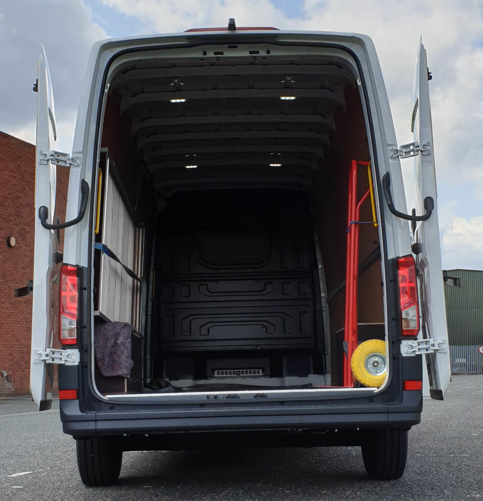 photo of urgent delivery vans with rear doors open