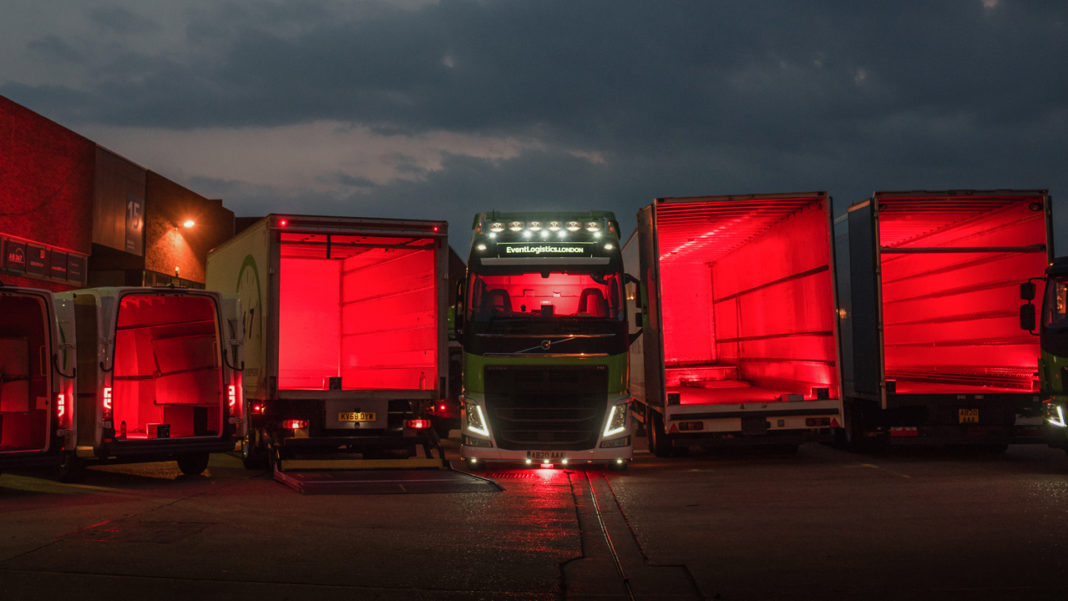 Empty A-D 24/7 Event trucks lit in red